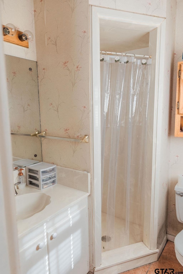 8105 Jewell Ln, Tyler, TX 75703 - bathroom with toilet, a stall shower, and vanity