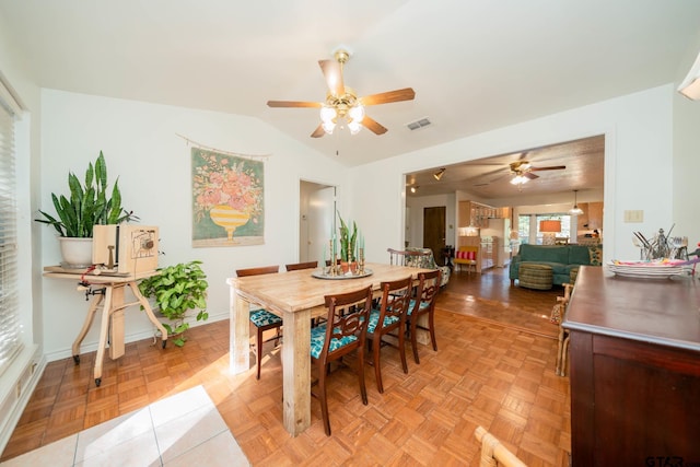 dining room featuring light parquet floors and ceiling fan