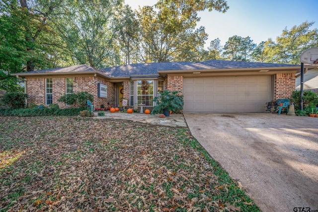 ranch-style house featuring a garage