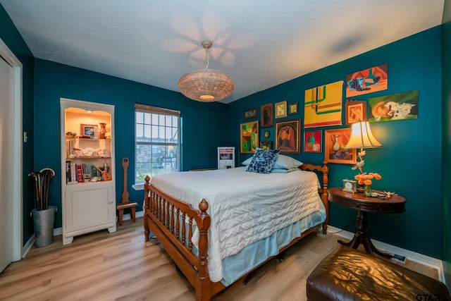 bedroom featuring hardwood / wood-style flooring