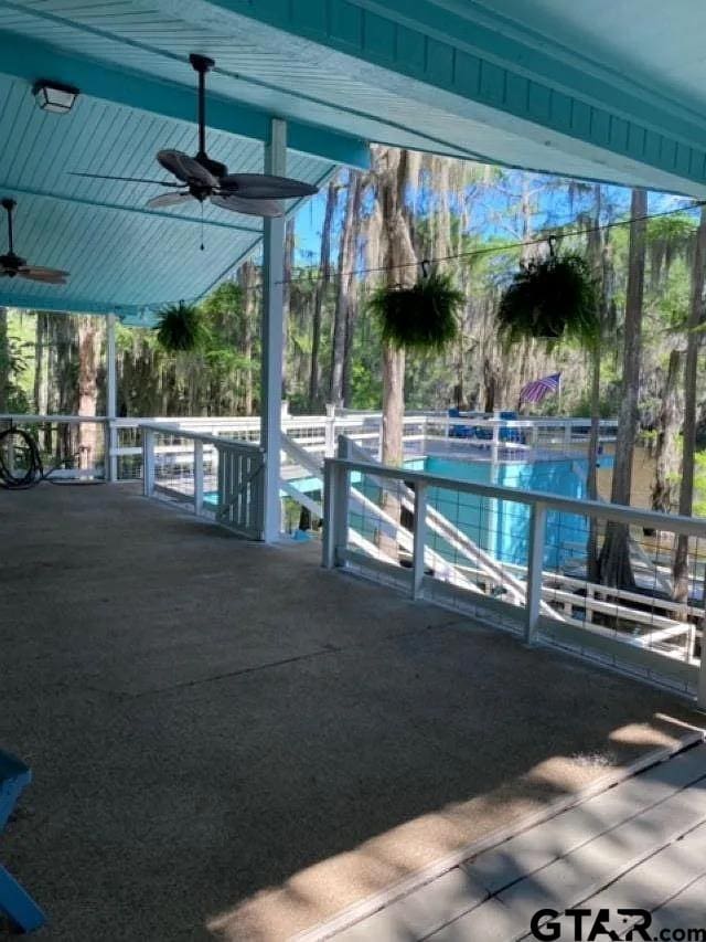 view of pool featuring ceiling fan