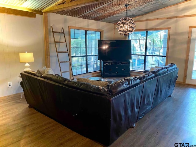 living room featuring a healthy amount of sunlight, hardwood / wood-style flooring, and wood ceiling