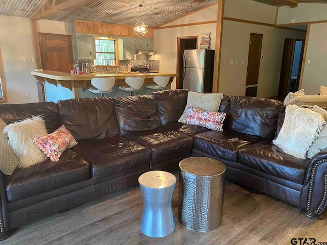 living room featuring hardwood / wood-style floors and lofted ceiling