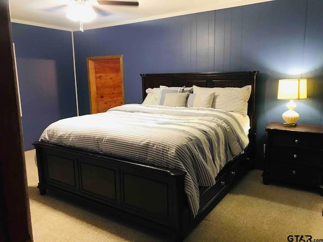 bedroom featuring light colored carpet and ceiling fan