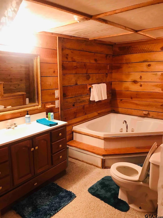 bathroom with a bathtub, wood walls, vanity, and toilet