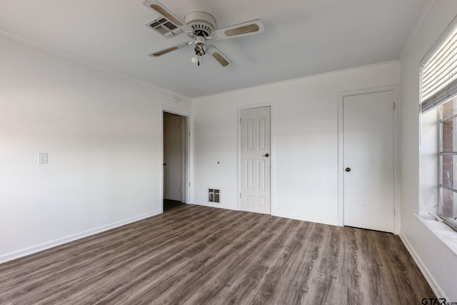 unfurnished bedroom with hardwood / wood-style floors, ceiling fan, and crown molding