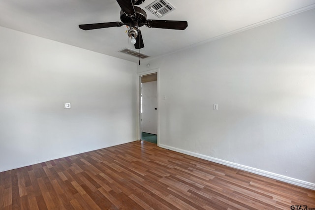 spare room featuring hardwood / wood-style flooring and ceiling fan