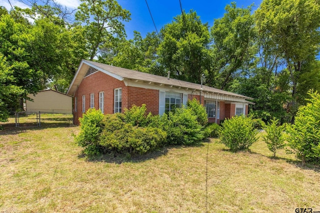 view of property exterior with a yard