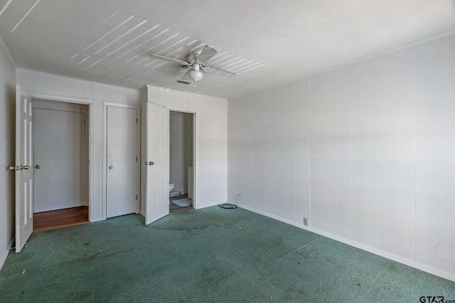 unfurnished bedroom featuring ceiling fan and dark colored carpet