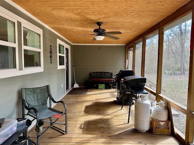 sunroom / solarium with wood ceiling and ceiling fan