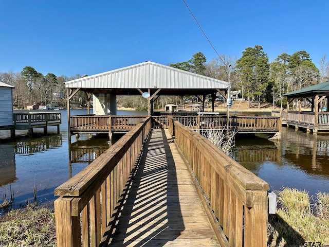 dock area with a gazebo and a water view