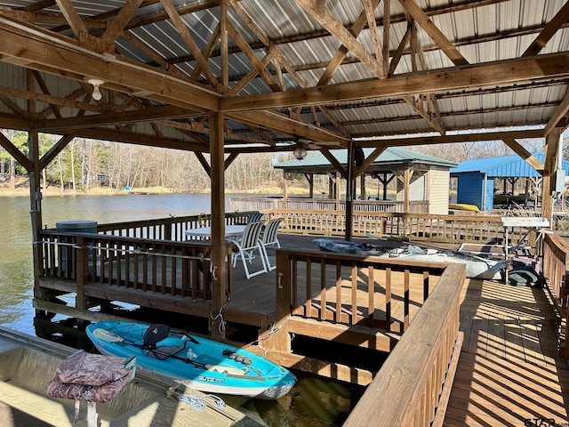 view of dock with a water view and a gazebo