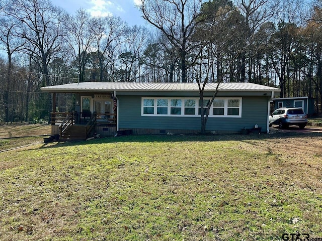 ranch-style home with covered porch and a front lawn