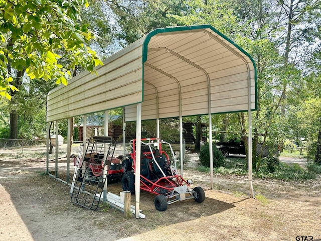 view of vehicle parking featuring a carport