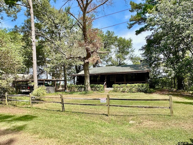 view of yard featuring a carport