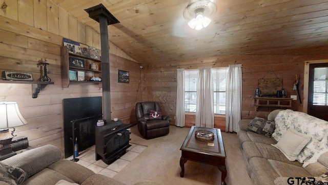 living room featuring a wood stove, a wealth of natural light, lofted ceiling, and wood ceiling