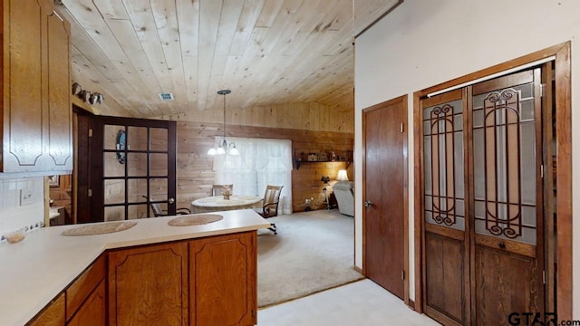 bathroom featuring vanity, wooden walls, wood ceiling, vaulted ceiling, and a chandelier