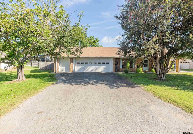 view of front facade featuring a garage and a front lawn