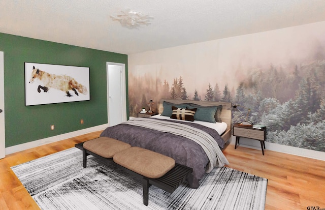 bedroom with hardwood / wood-style flooring