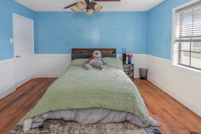 bedroom featuring wood-type flooring and ceiling fan