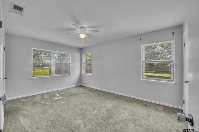 empty room featuring carpet flooring and ceiling fan