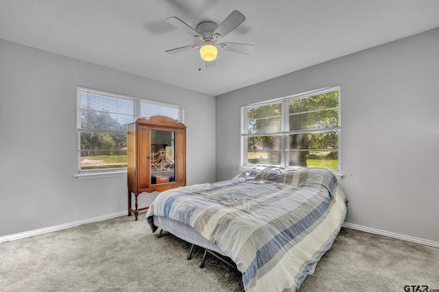 bedroom with ceiling fan and carpet floors