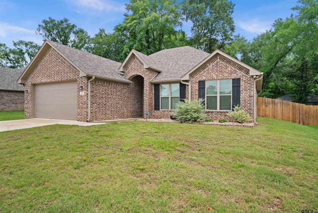 single story home with a garage and a front yard