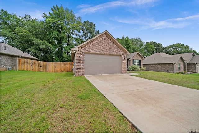 view of front of house with a garage and a front lawn