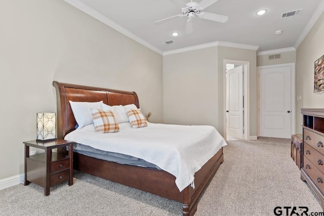 bedroom featuring ornamental molding, visible vents, and light carpet