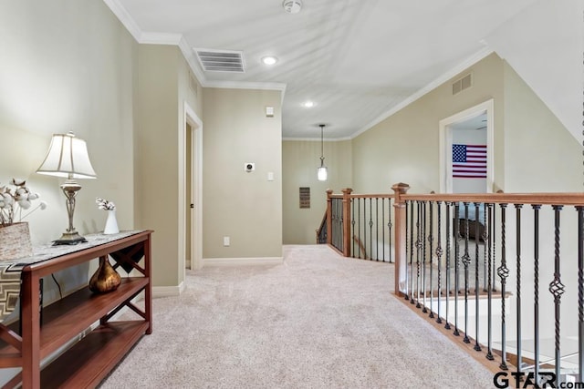 hallway with light carpet, crown molding, visible vents, and an upstairs landing