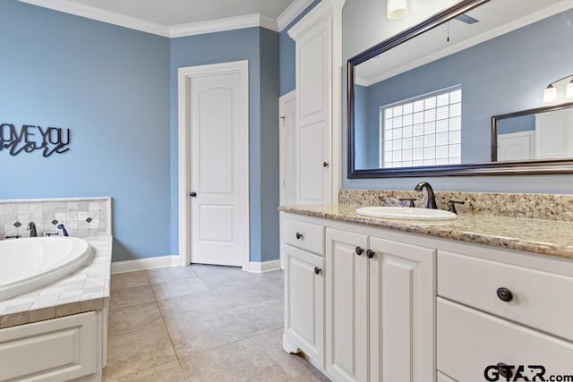 bathroom featuring baseboards, tile patterned floors, a garden tub, crown molding, and vanity