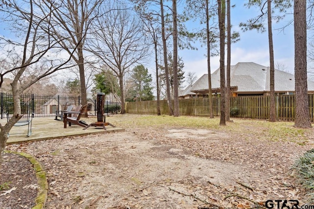 view of yard with a patio area and a fenced backyard