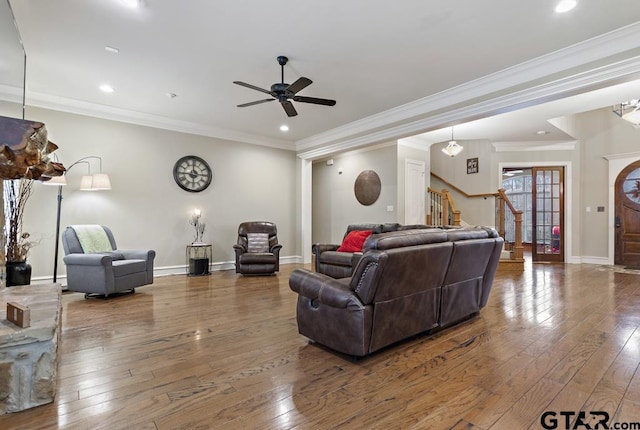 living room with stairway, recessed lighting, wood finished floors, and baseboards