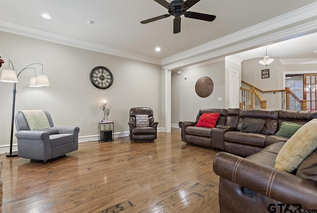 living room featuring crown molding, recessed lighting, stairway, wood finished floors, and baseboards