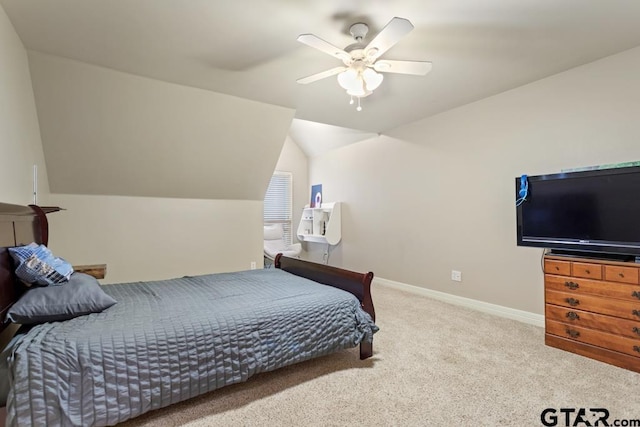 bedroom featuring vaulted ceiling, ceiling fan, baseboards, and light colored carpet