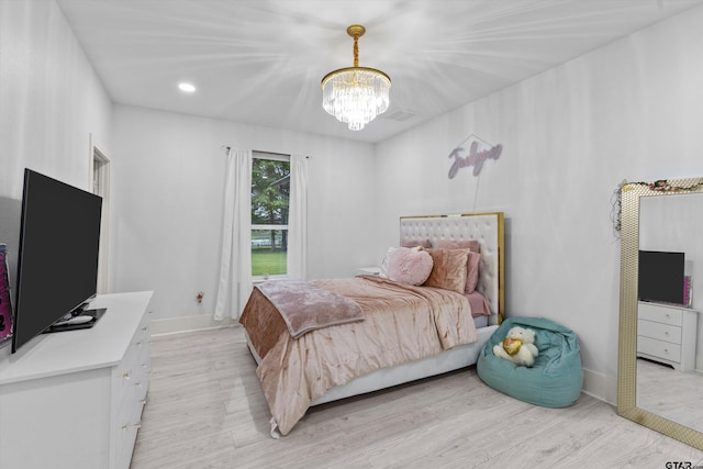 2680 Primera Rd, Tyler, TX 75705 - bedroom with a chandelier, light wood-style floors, baseboards, and recessed lighting