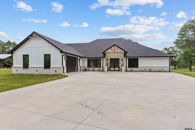 2680 Primera Rd, Tyler, TX 75705 - modern inspired farmhouse featuring board and batten siding, driveway, a front lawn, and a garage