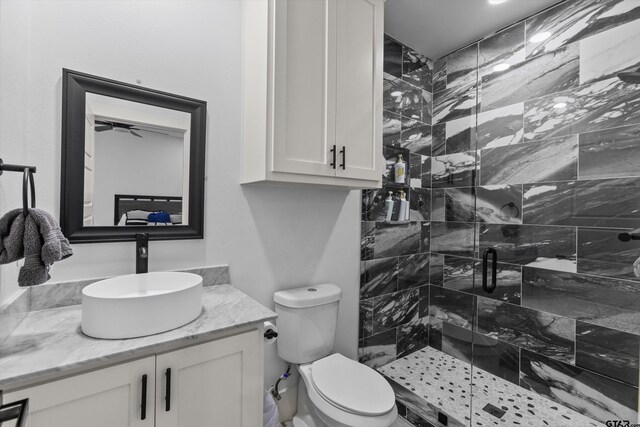 2680 Primera Rd, Tyler, TX 75705 - bathroom featuring a stall shower, vanity, and toilet