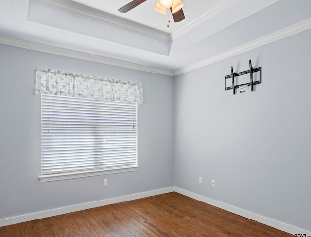 empty room with ornamental molding, wood-type flooring, and ceiling fan