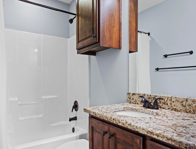 full bathroom with vanity, shower / bath combo with shower curtain, and toilet