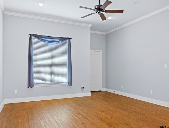 unfurnished room with ornamental molding, hardwood / wood-style floors, and ceiling fan