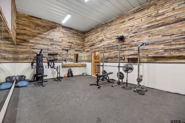 exercise area with a high ceiling