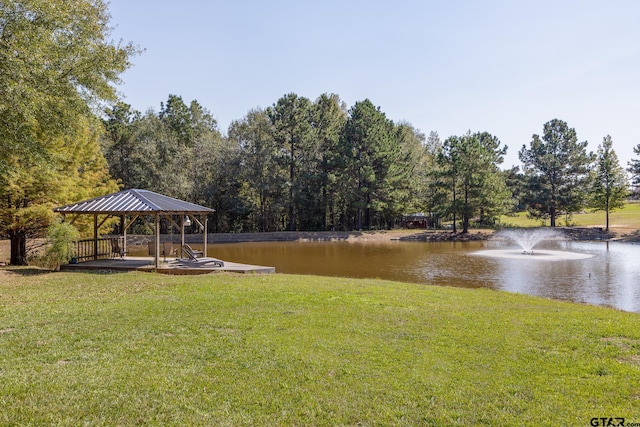 view of yard with a gazebo and a water view