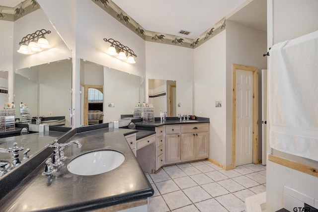 bathroom featuring tile patterned flooring and vanity