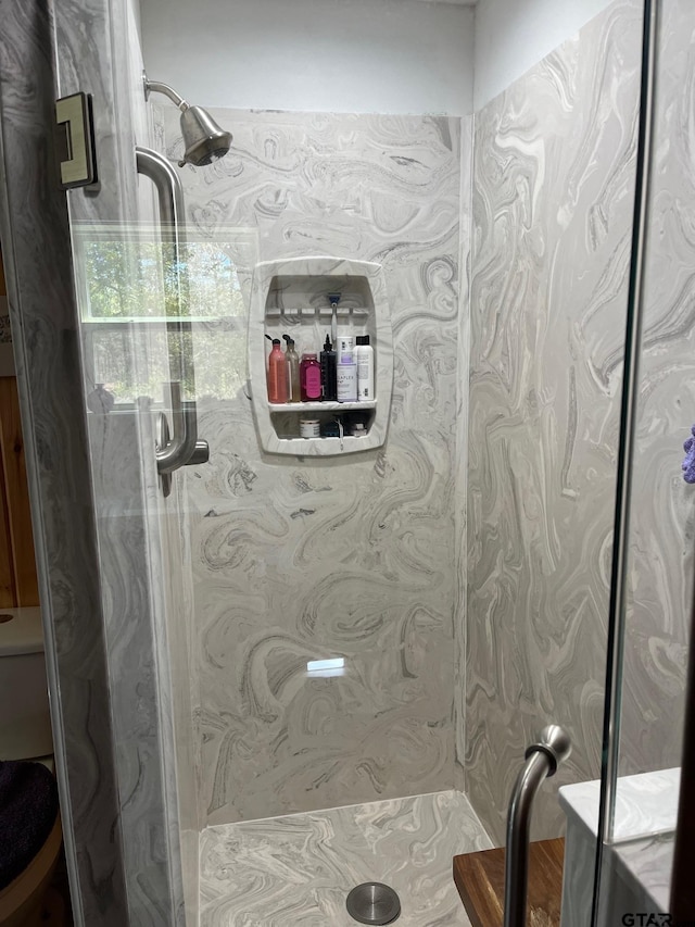 bathroom featuring a shower stall