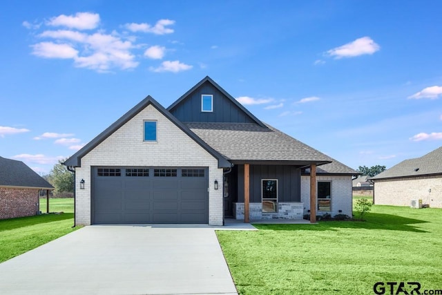 view of front of home featuring a garage and a front lawn