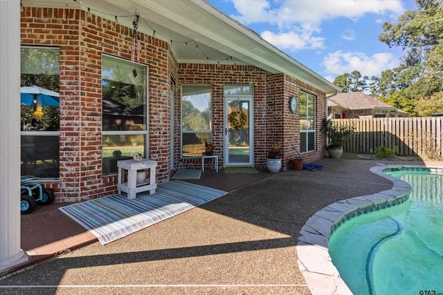 view of patio featuring a fenced in pool