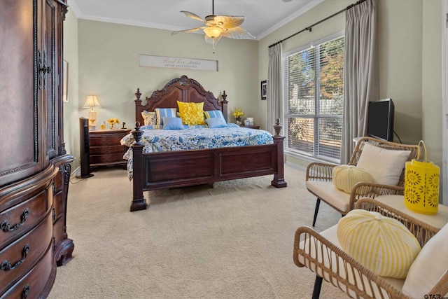 carpeted bedroom with ceiling fan and crown molding