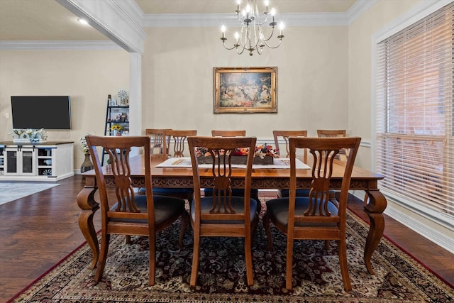 dining room with a chandelier, dark hardwood / wood-style floors, and crown molding