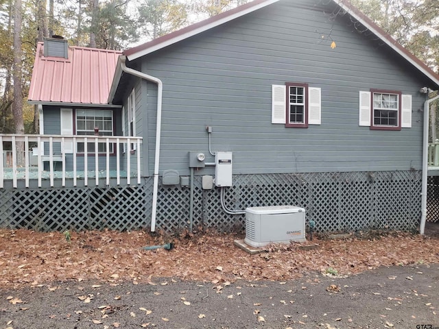 view of side of home featuring a deck